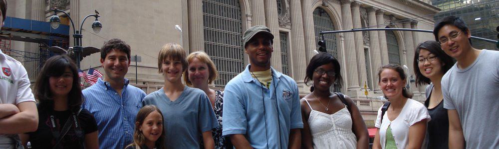 Tours by Foot guide with tour group ion Wall Street, New York City