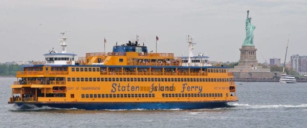 Staten Island Ferry near the Statue of Liberty. Image Source: Wikimedia.