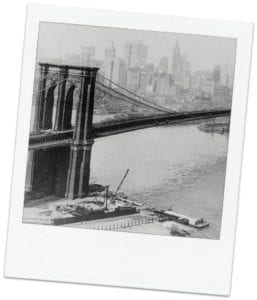 old photograph of the construction of the Brooklyn Bridge