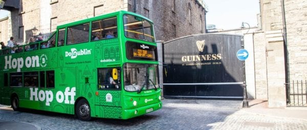 A Do Dublin bus passing by the Guinness Storehouse. Image Source: Do Dublin.