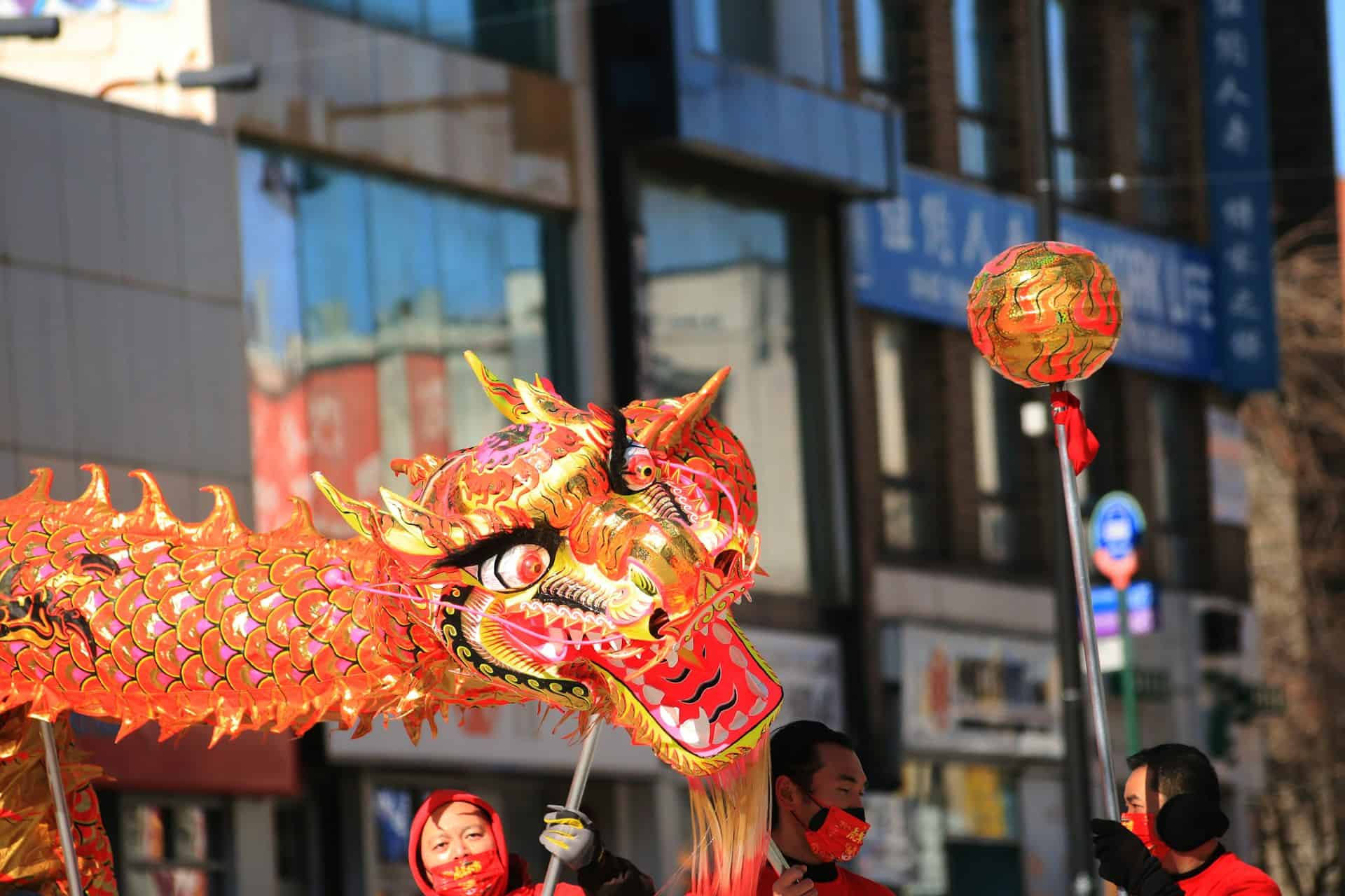A large paper dragon on sticks during Chinese New Year Parade in NYC
