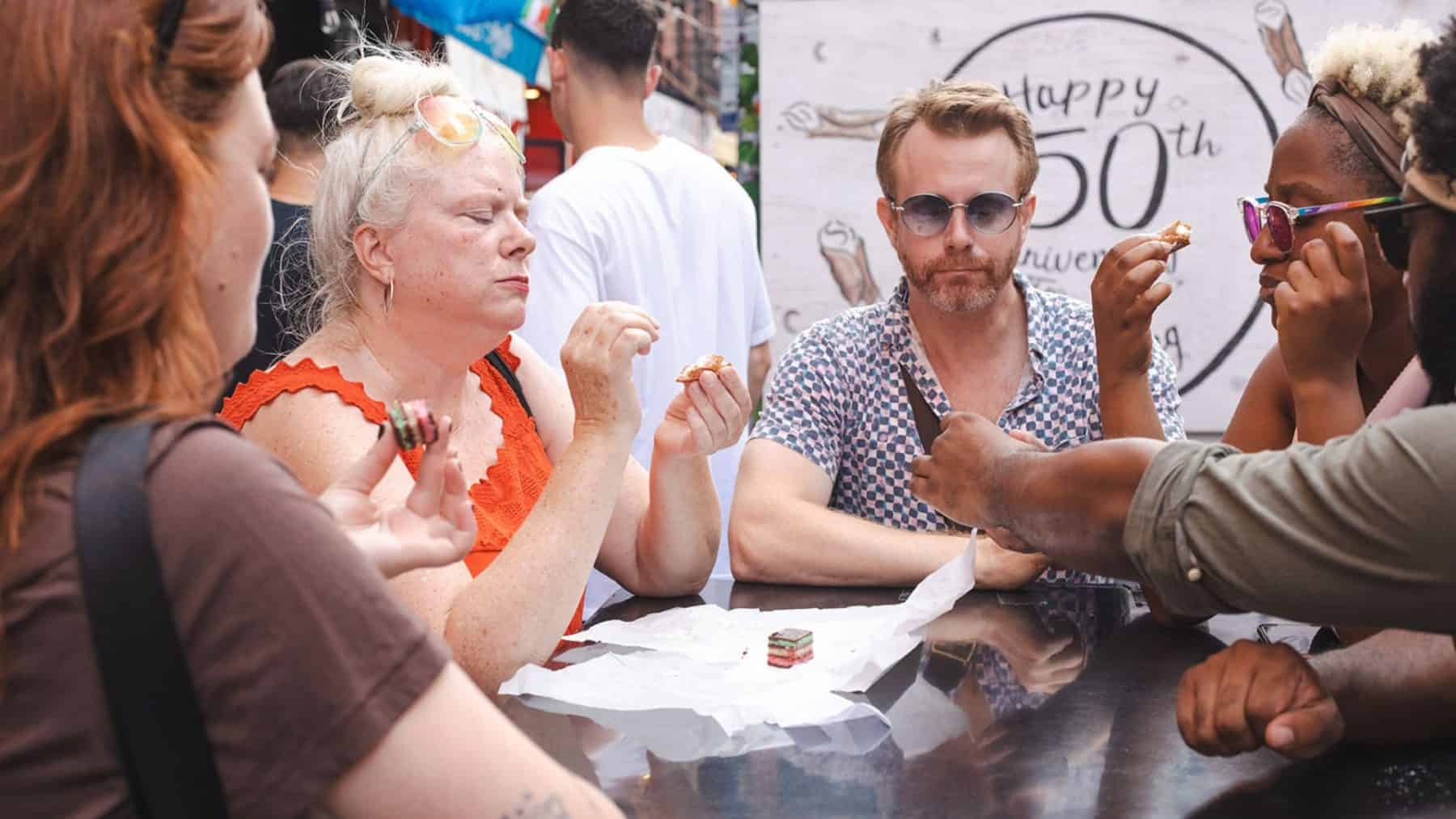 people eating food on a food tour