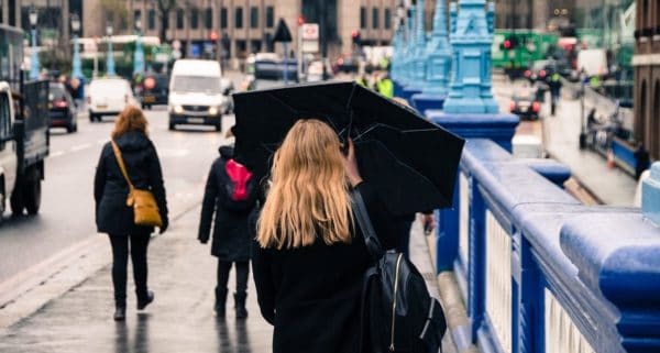Woman with an umbrella in London. Source: Pixabay user Skitterphoto.