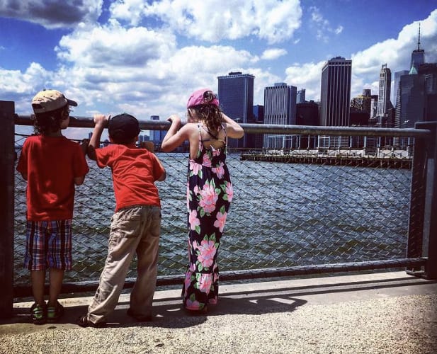 Children looking at New York City skyline
