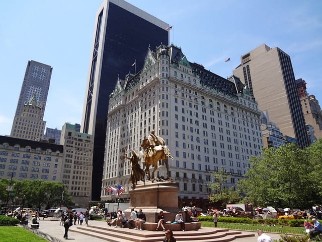 Plaza Hotel in front with the building where Chandler works in the background. Image source: Pixabay user zopliac.