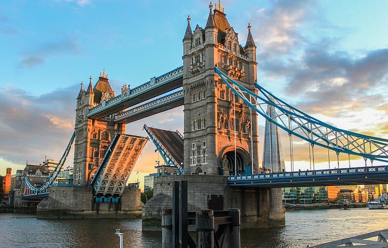 The Tower Bridge opening during magic hour. Image source: Pixabay user Richard Ley.