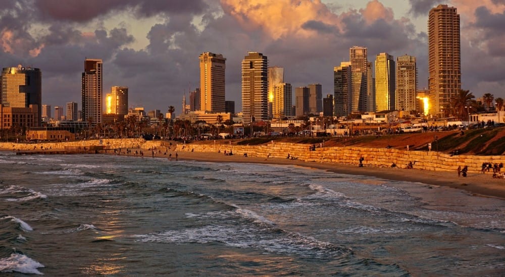 A shot of Tel Aviv from the water at sunset. Image source: Pixabay user Volker Glatsch.