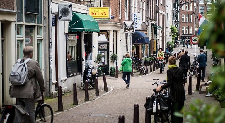 Another street in Amsterdam lined with coffeeshops and cafes. Image source: Pixabay user 9189139.