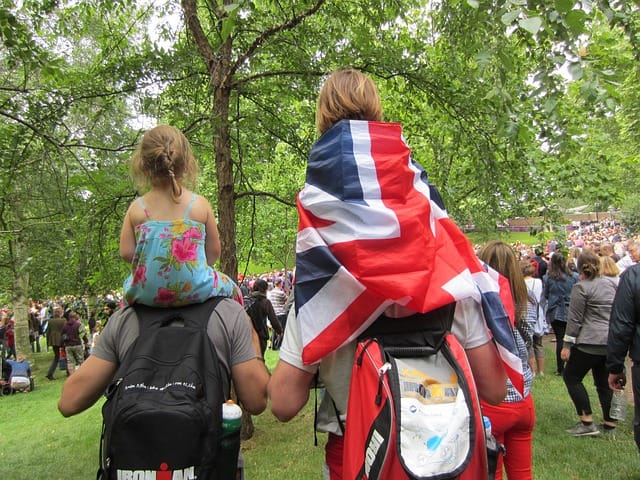 Parents and their children in Hyde Park, London. Image source: Pixabay user Annie Bridie.