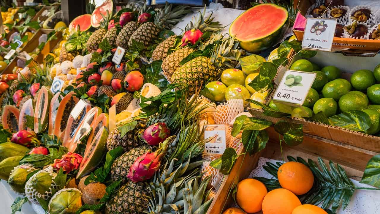 A selection of fruits from a market stall in Madrid. Image source: Pixabay user Steve Wilson.