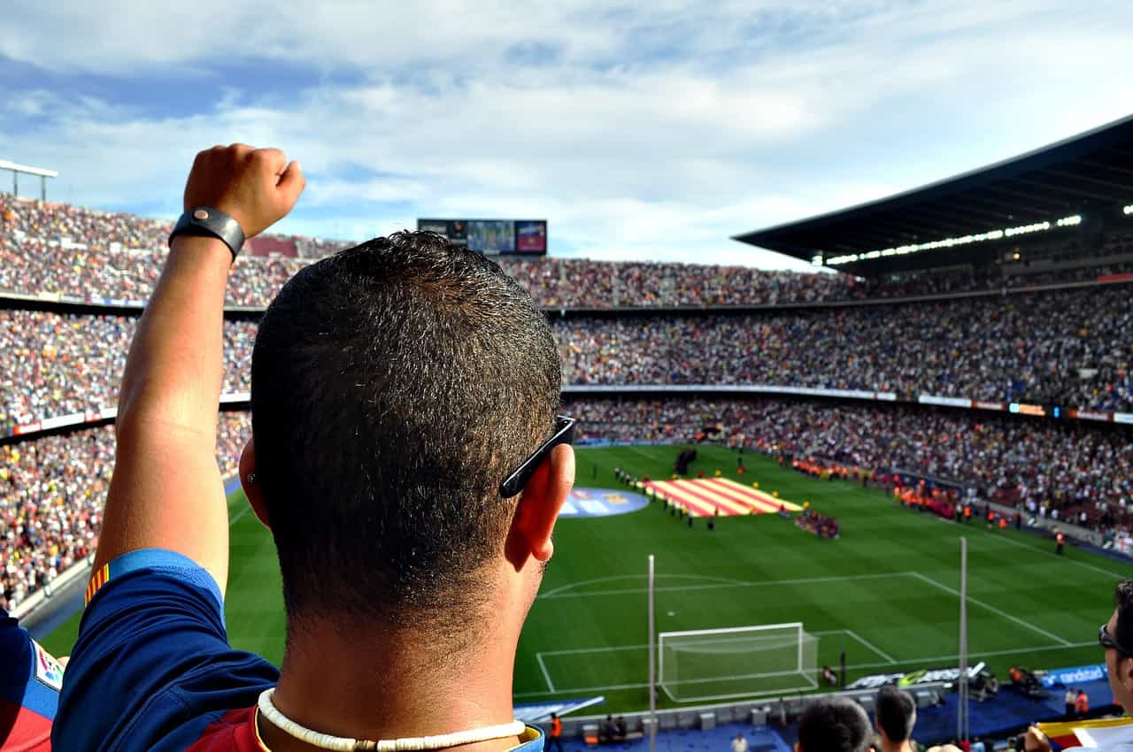 A fan cheering on their team in Barcelona. Image source: Pixabay user Damon Nofar.