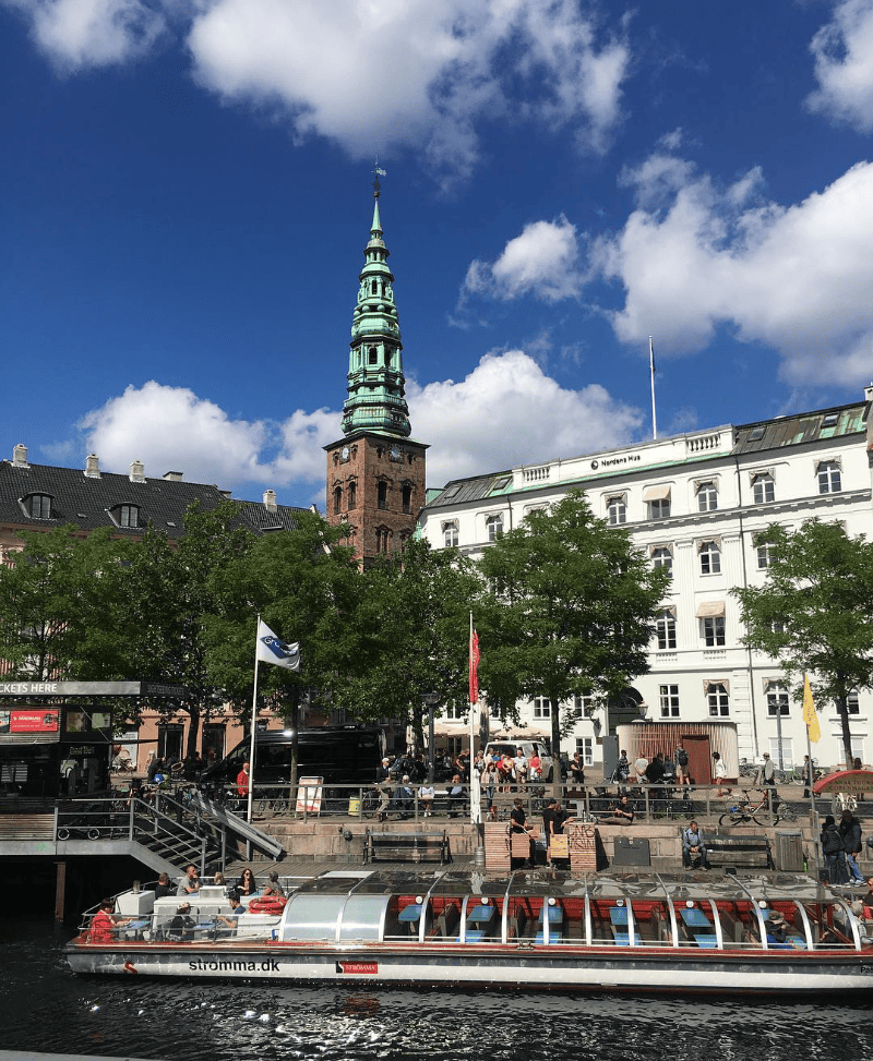 A canal tour runs along the water in Copenhagen