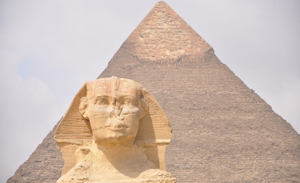 The Sphinx in front of one of the pyramids of Giza. Pixabay user MChuc.