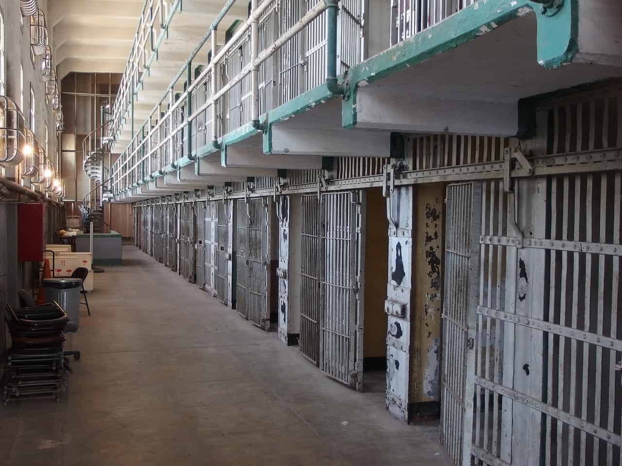 A row of jail cells in Alcatraz. Image source: Pixabay user Marcello Rabozzi.