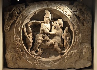 A white marble relief depicting a Mithras bull-slaying scene, located in the London Mithraeum Temple. Image Source: Wikimedia user Carole Raddato under the Creative Commons Attribution-Share Alike 2.0 Generic license.