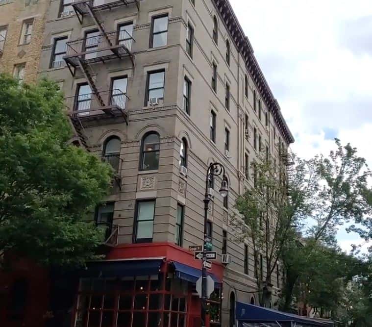 The building that was the exterior for the Friends TV show with a cafe at the bottom.